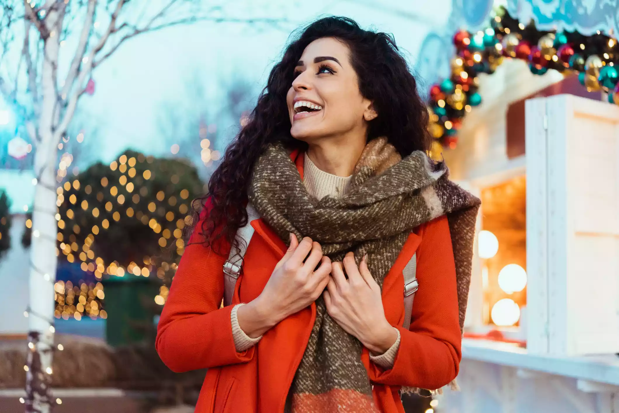 Happy woman in festive attire, Ohio plastic surgery services