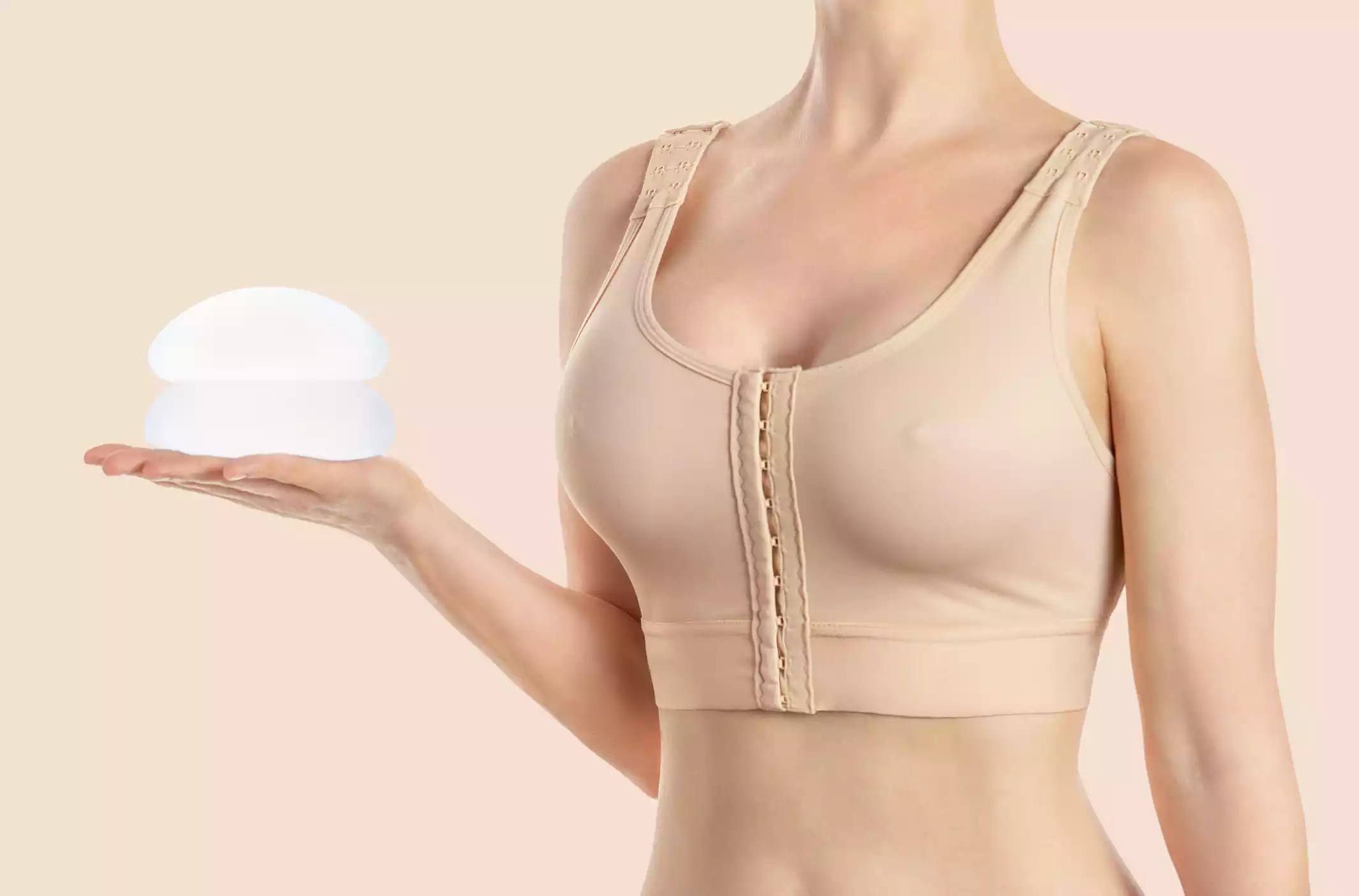 woman with breast implants Patient displaying successful breast implants from Ohio specialists.