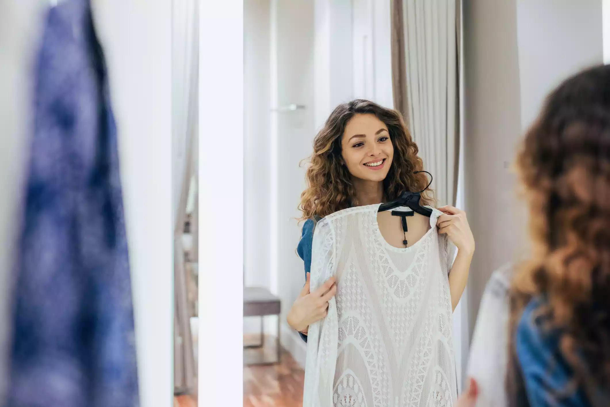 Trying on clothes emphasizing fashion and wardrobe selection