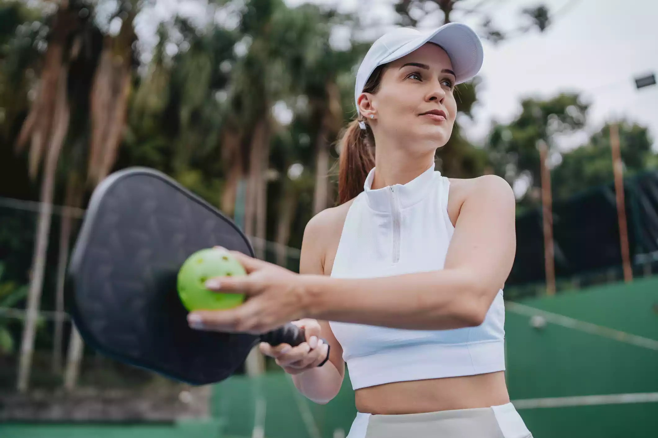 Woman playing pickleball staying active and healthy